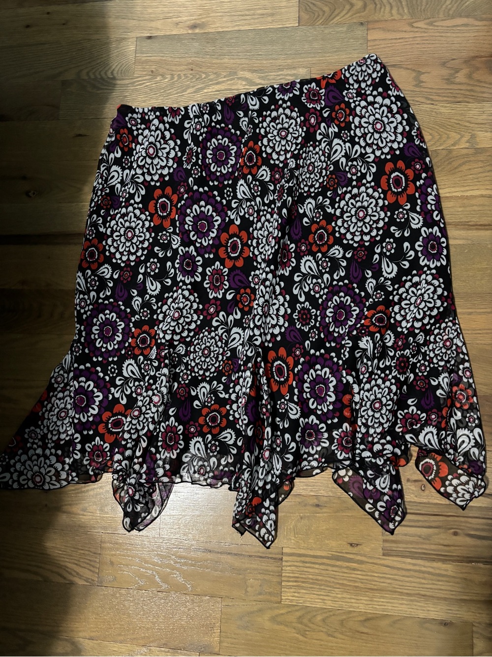 Cato Floral Handkerchief Hem Skirt in Black with Purple & Red Accents